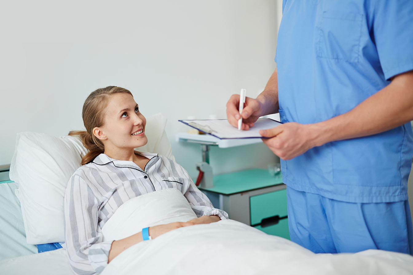 Happy young patient listening to her doctor prescriptions